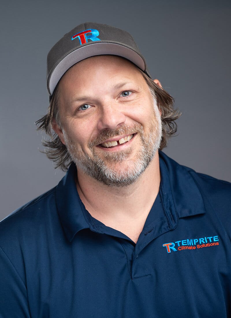 Portrait of Adam, a professional team member at Temprite, smiling for a staff photo