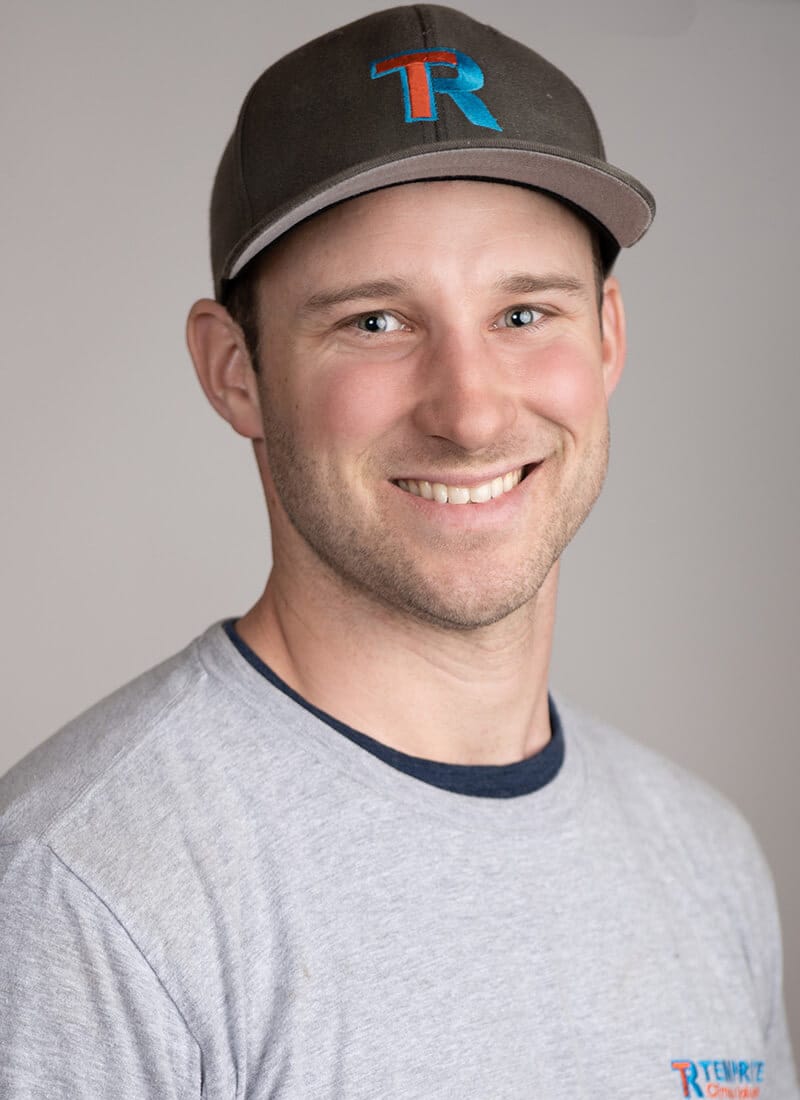 Portrait of Chris, a professional team member at Temprite, smiling for a staff photo