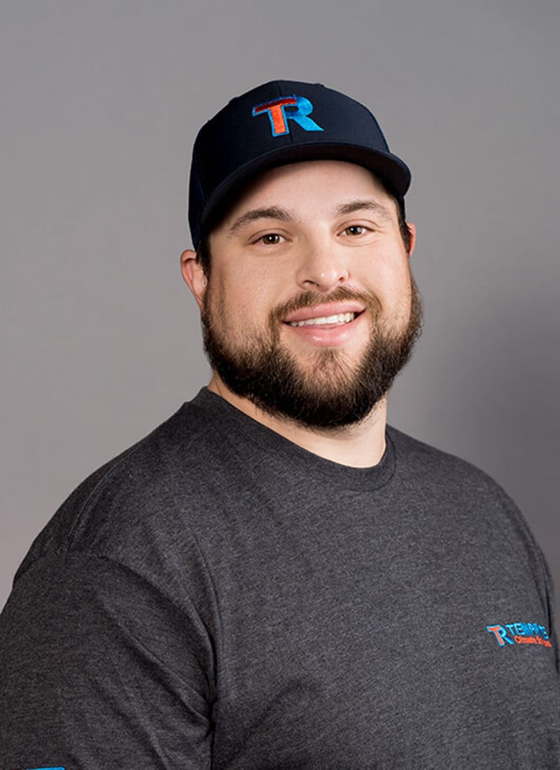 Portrait of Corde, a professional team member at Temprite, smiling for a staff photo