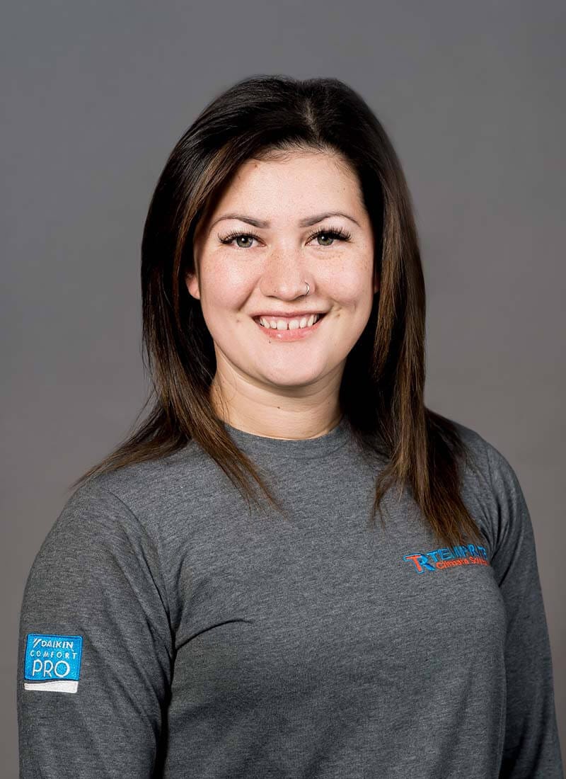 Portrait of Faye, a professional team member at Temprite, smiling for a staff photo