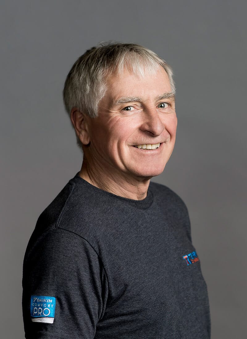 Portrait of Joe, a professional team member at Temprite, smiling for a staff photo