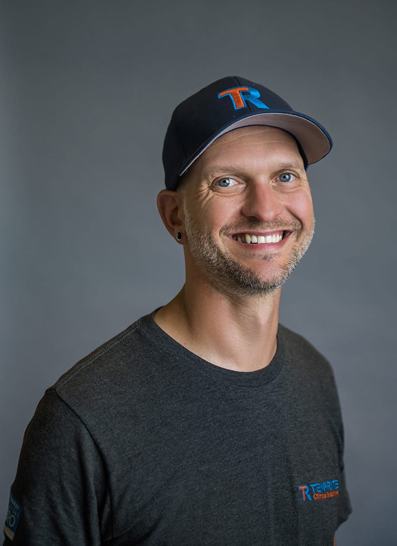Portrait of Kyle, a professional team member at Temprite, smiling for a staff photo