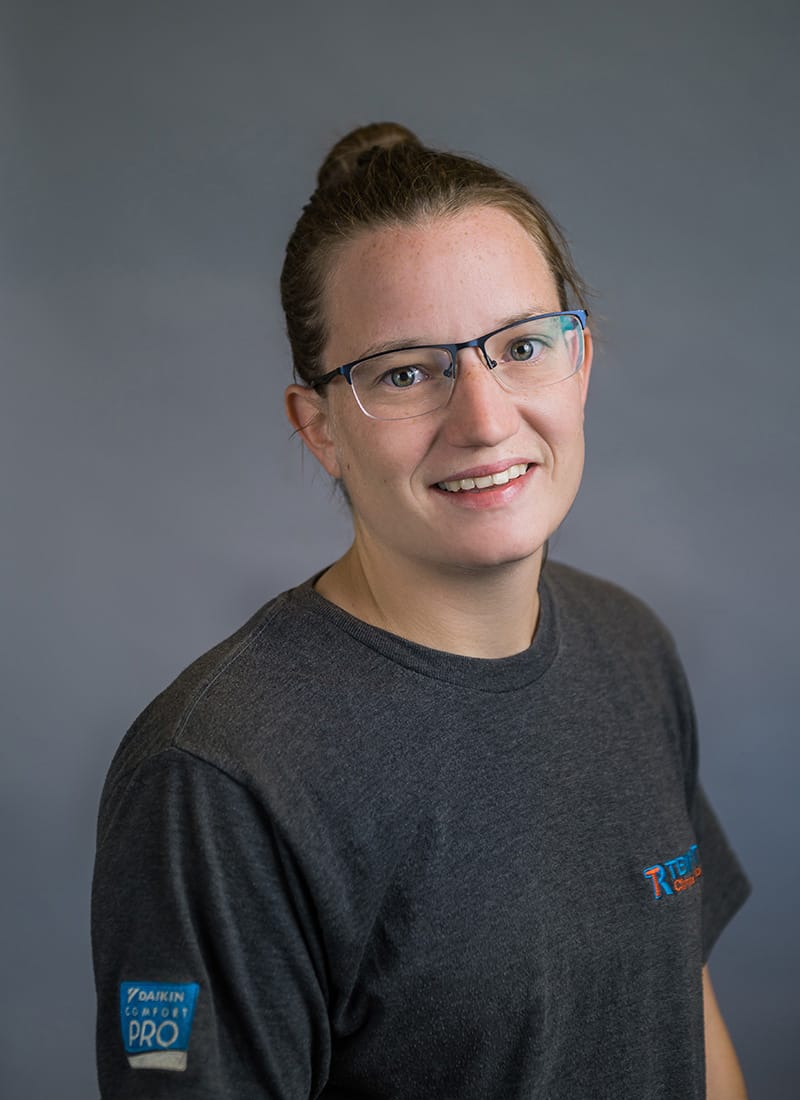 Portrait of Nicole, a professional team member at Temprite, smiling for a staff photo