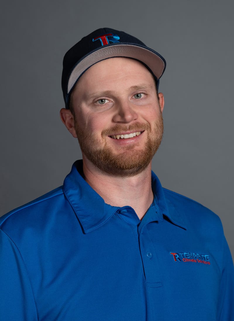 Portrait of Reid, a professional team member at Temprite, smiling for a staff photo