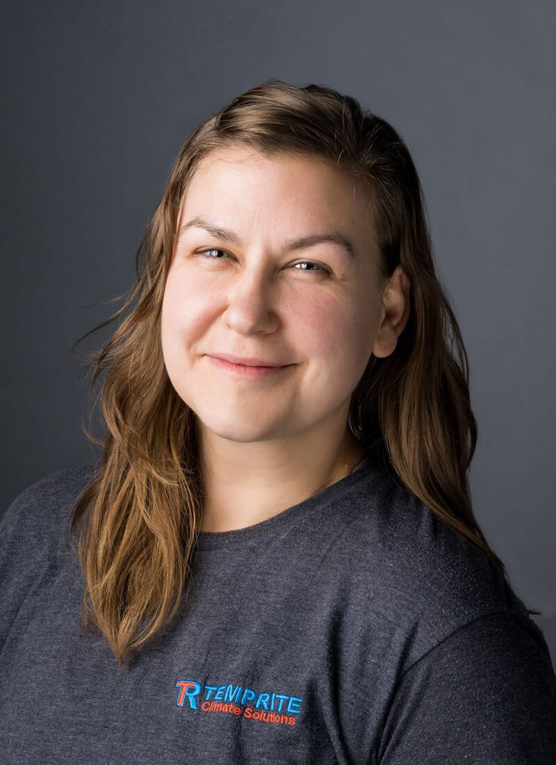 Portrait of Sarah, a professional team member at Temprite, smiling for a staff photo
