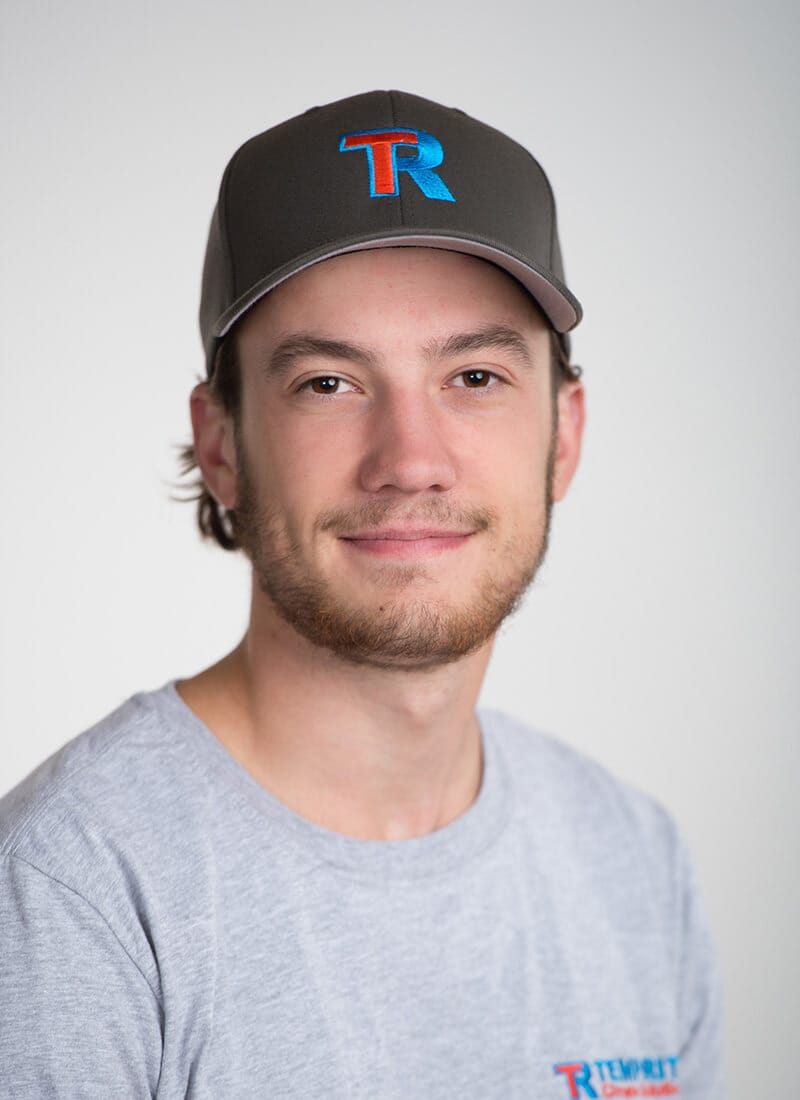 Portrait of Tristan, a professional team member at Temprite, smiling for a staff photo