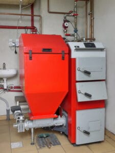 A bright red residential boiler
