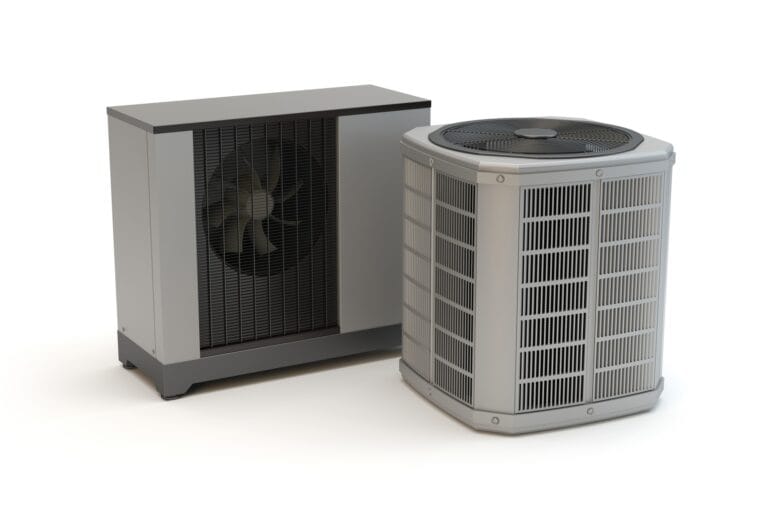 Two grey heat pumps sitting on a white background