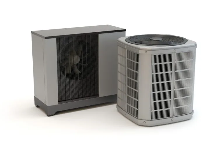 Two grey heat pumps sitting on a white background