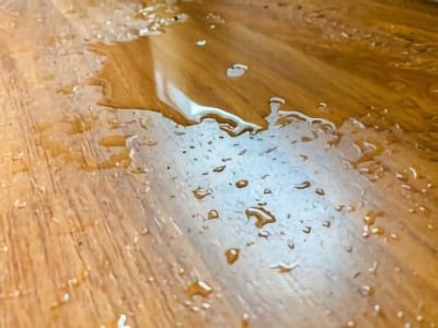 Water puddle on a wooden floor